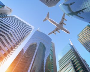 Airplane flying over skyscrapers n city downtown district. Business corporate travel background concept. 3d illustration